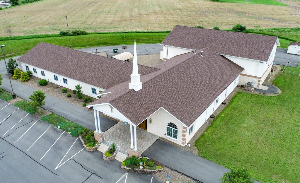 A drone captures a completed commercial building roof, highlighting commercial roof installation and commercial roofing services by Goodridge Construction, including gutter installation for durable, watertight, and energy-efficient results.