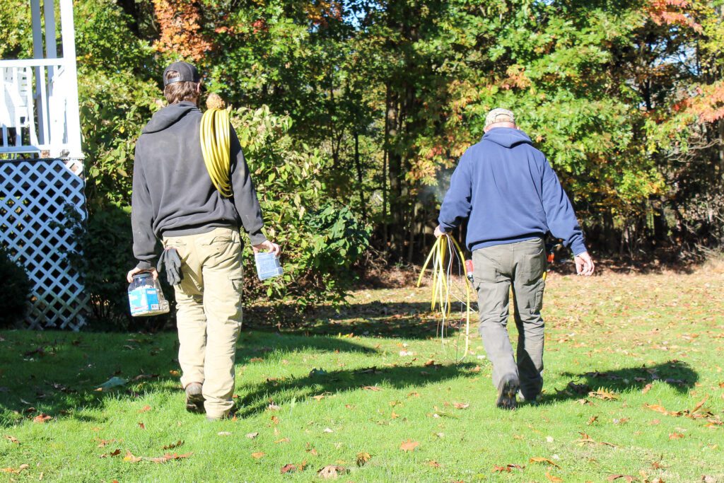 Two electricians carrying wiring for installation, performing Electrical Remodeling and Renovations, electrical panel upgrades, and home wiring and integration as part of professional Residential Electrical Services to ensure efficient and compliant setups.